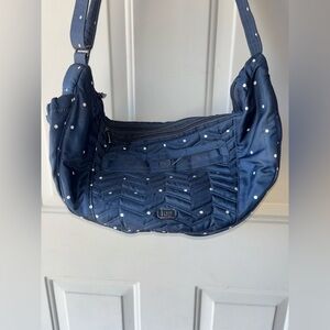 Lug Boomerang navy polka dot handbag